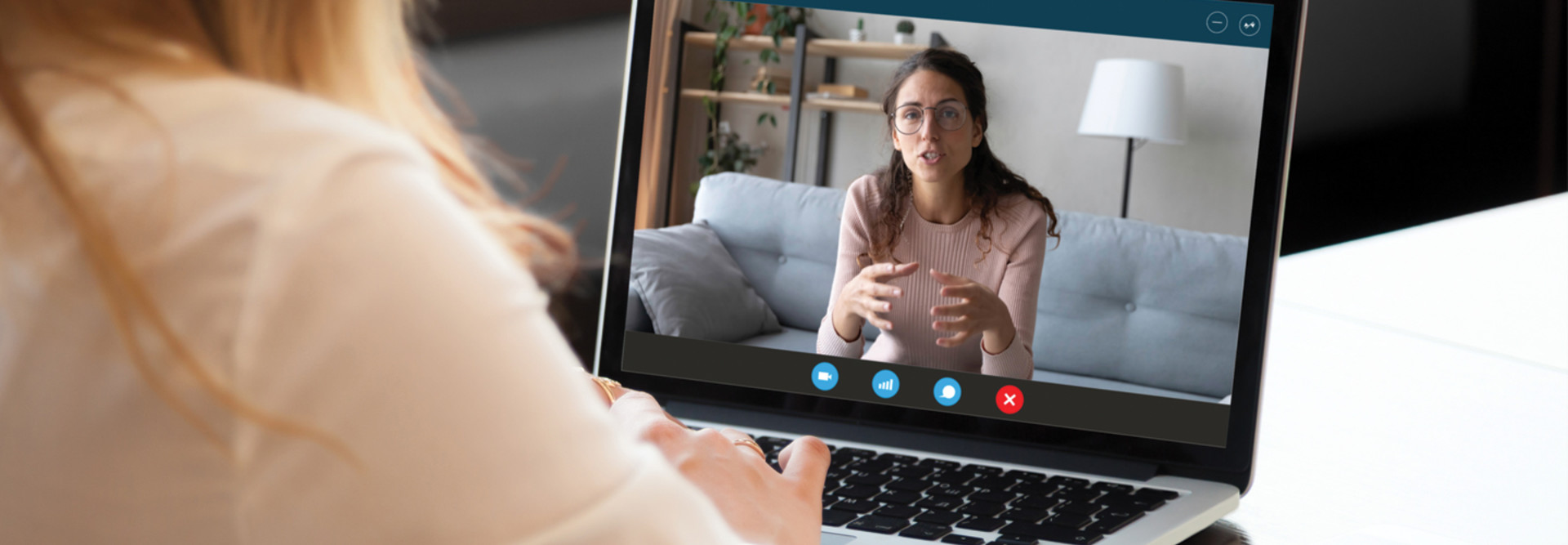 Woman talking on computer screen through videoconferencing 