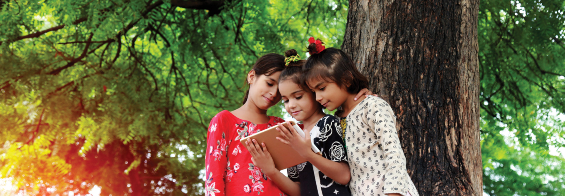 Students use a tablet for school in their community