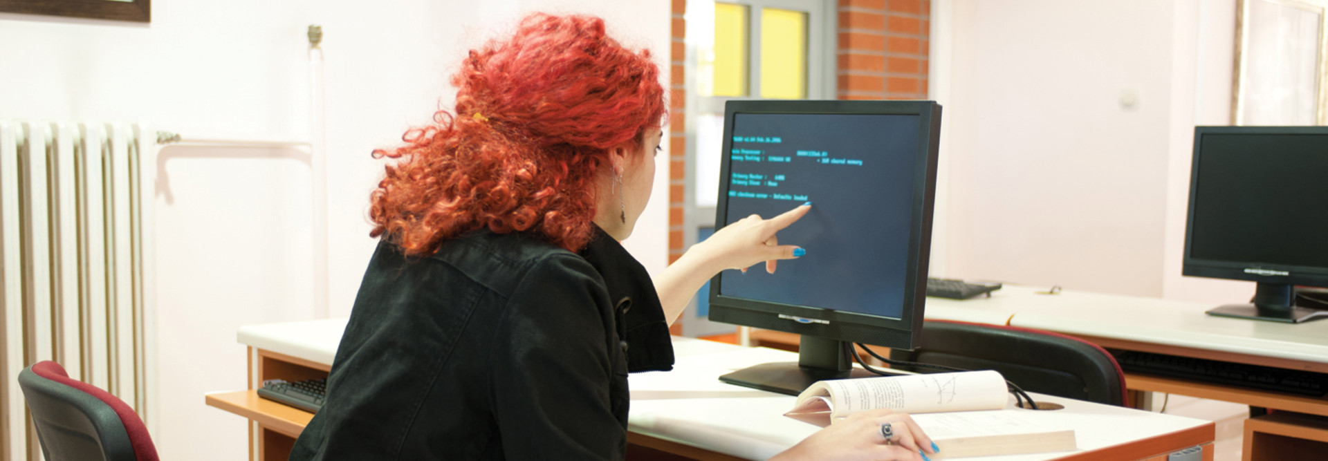 Threat Intelligence - woman in front of computer