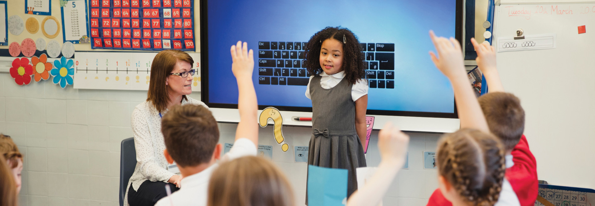 Student in front of class - internet of things technology classroom