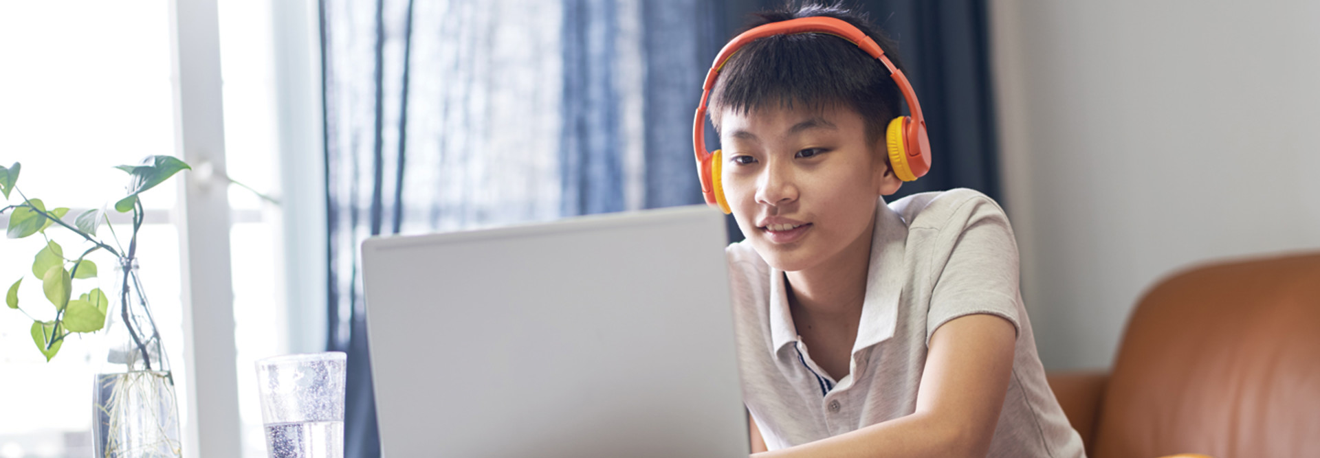 K–12 student watching videos at home in flipped-classroom model
