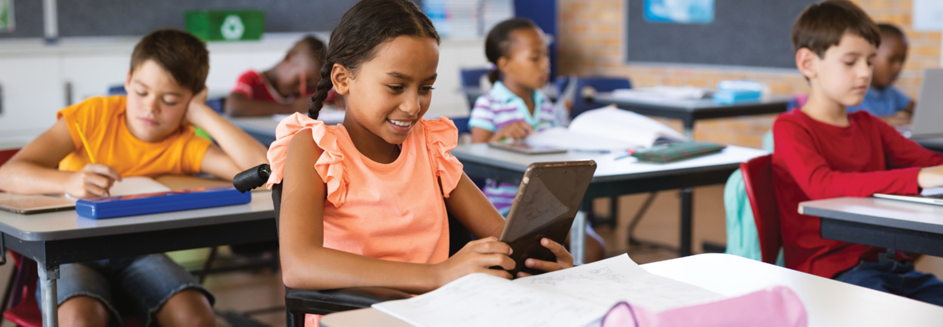K–12 Student Using Integrated Tablet Technology in the Classroom