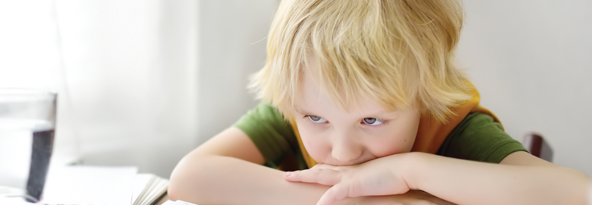 SEL young K–12 student looking bored or sad