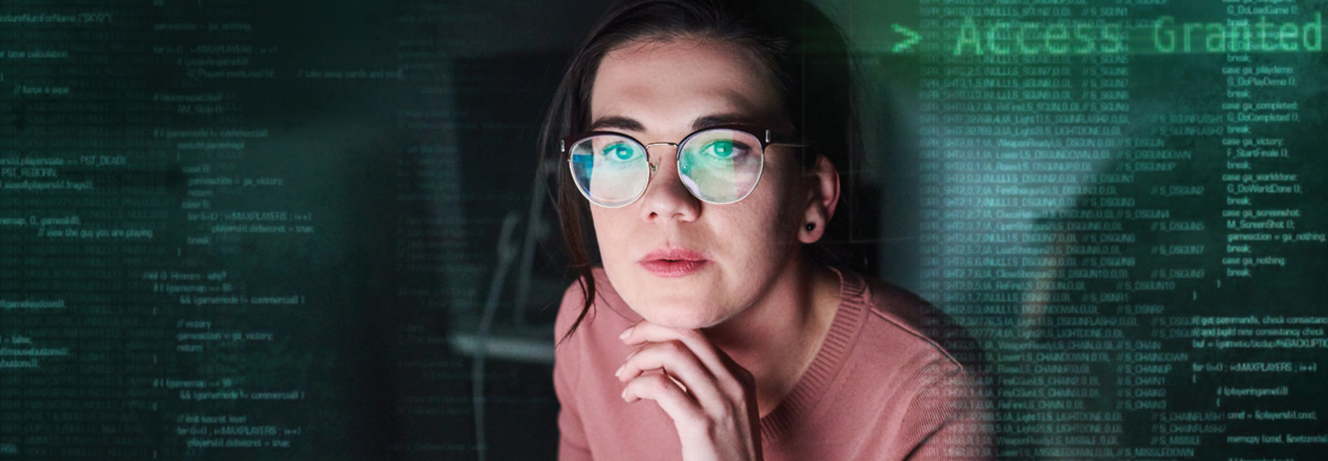 cybersecurity IT woman looking at screen