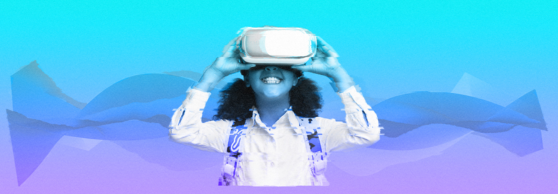 smiling student uses Virtual Reality headset