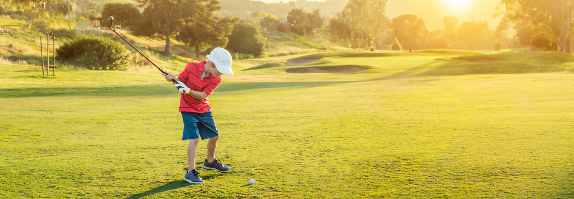 Boy golfing