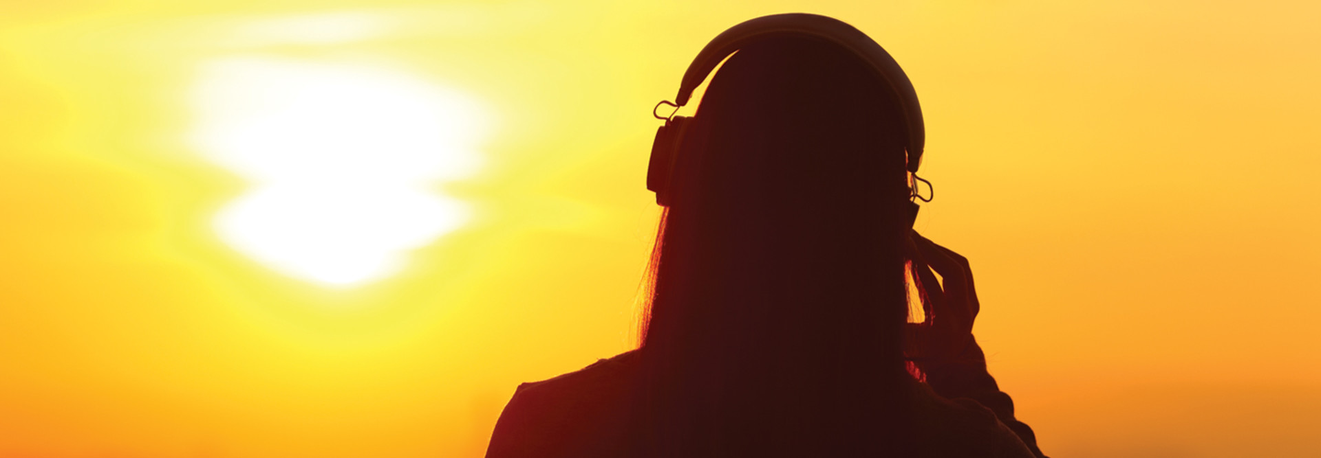 student using headphones silhouette