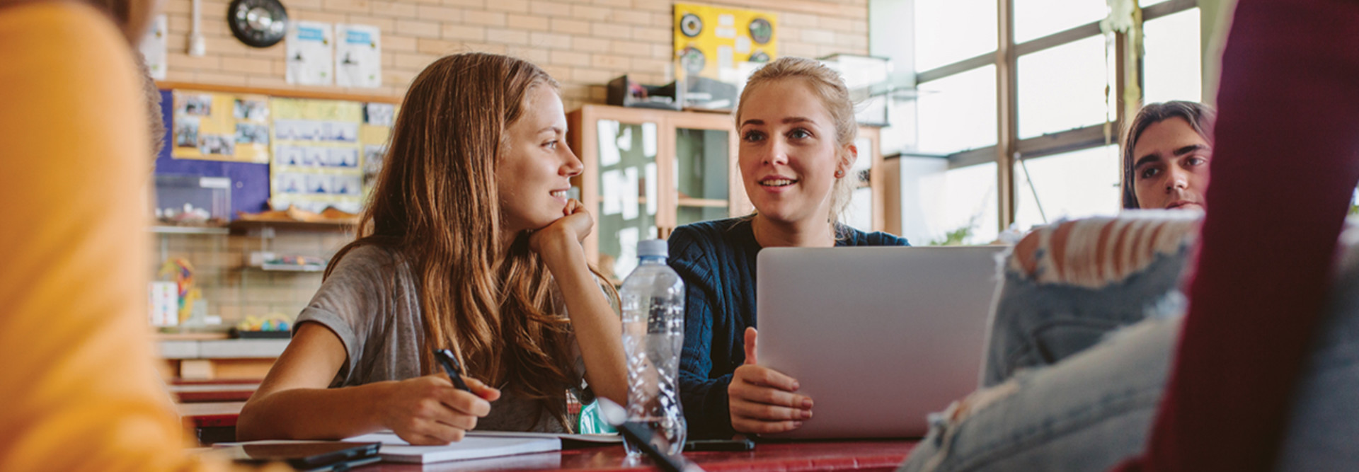 high school students talking in a class