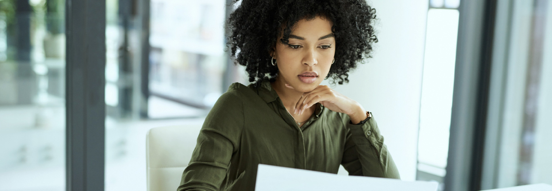 Businesswoman going over paperwork