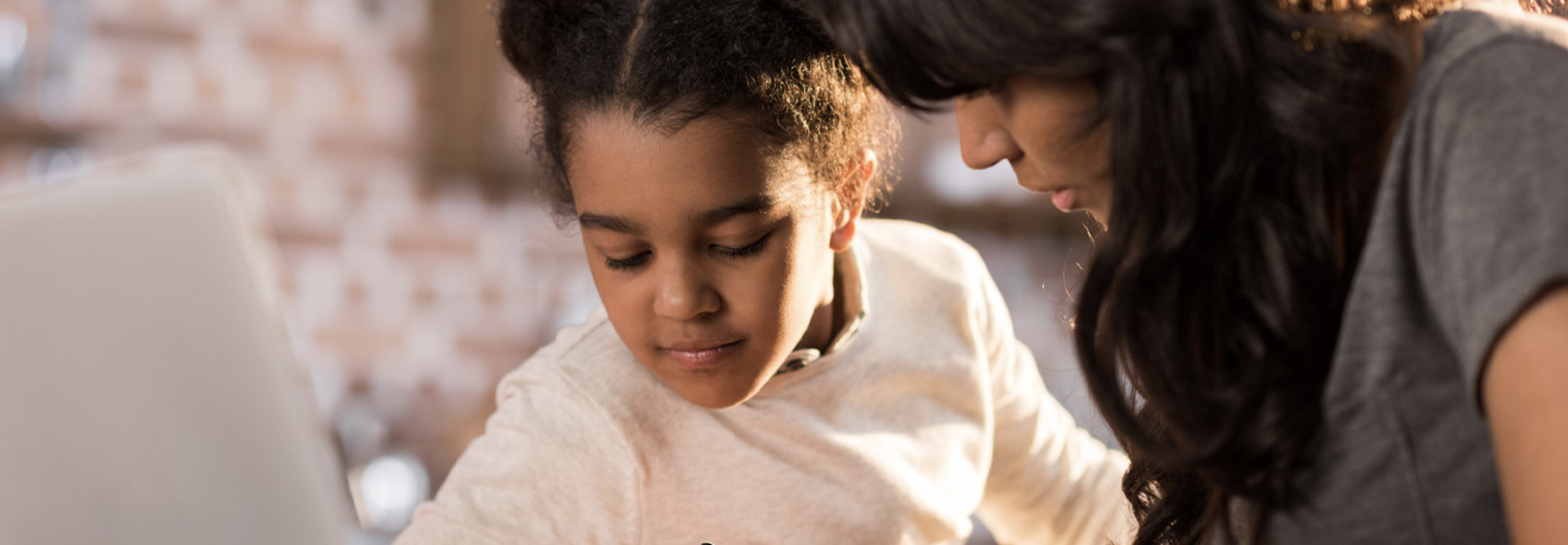 Parent helping child with school work