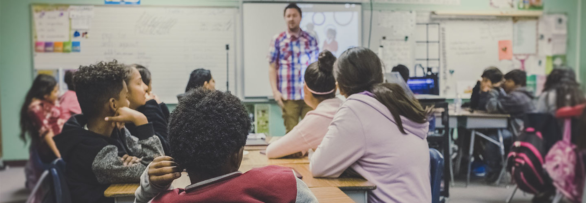 Teacher lecturing K-12 students