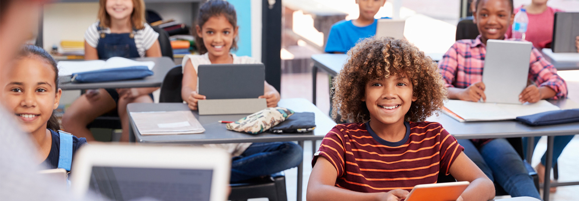 Elementary students using devices