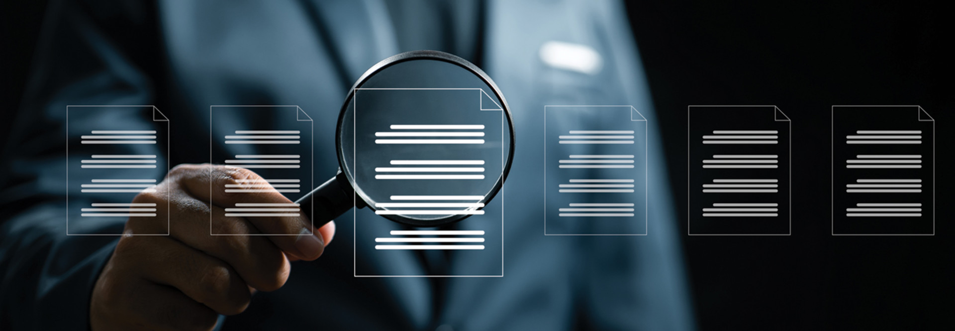 managed detection magnifying glass looking at documents