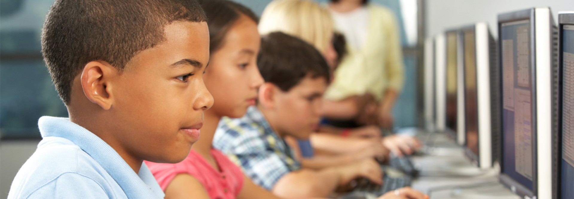 Elementary school students with computers