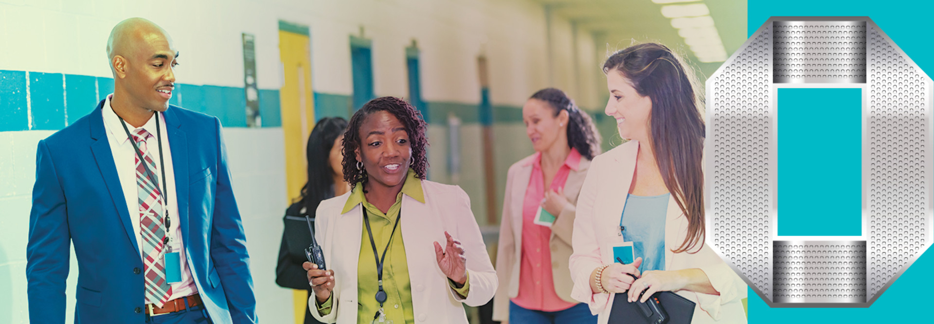 Staff having discussion in school hallway