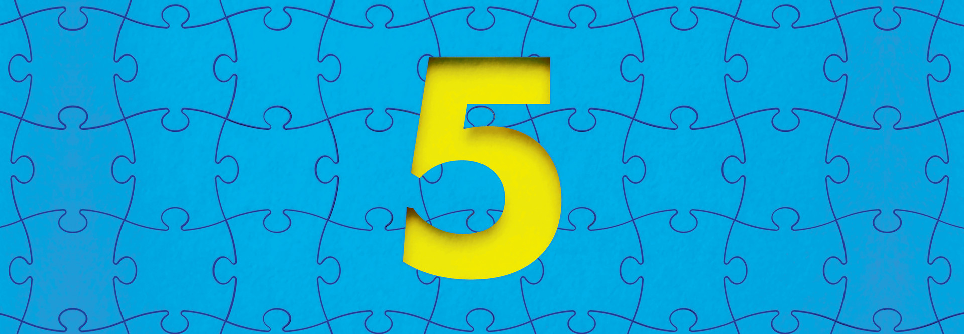 yellow numeral 5 in the negative space of blue puzzle pieces