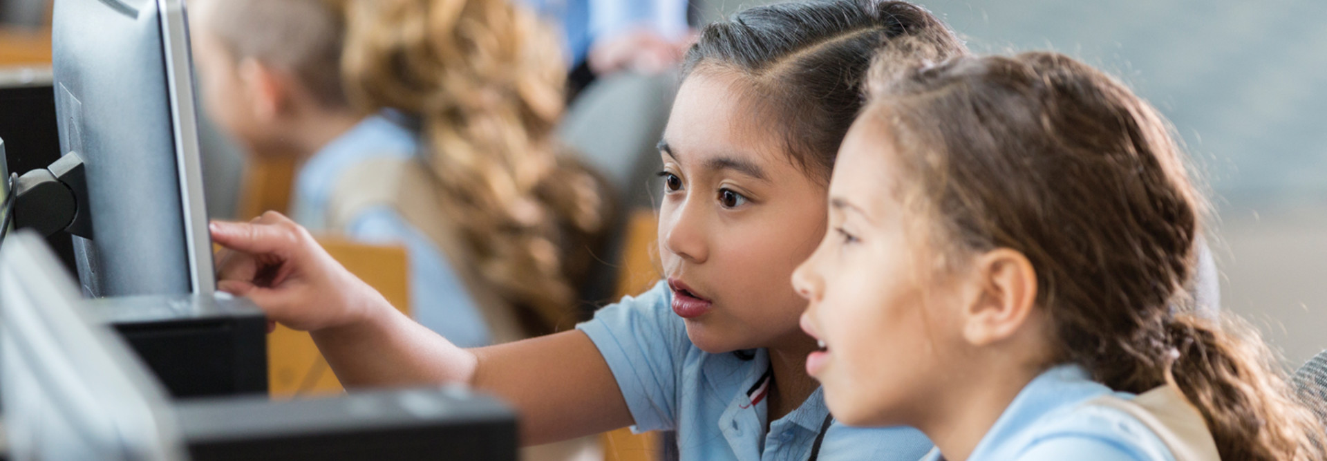 Students using devices in class