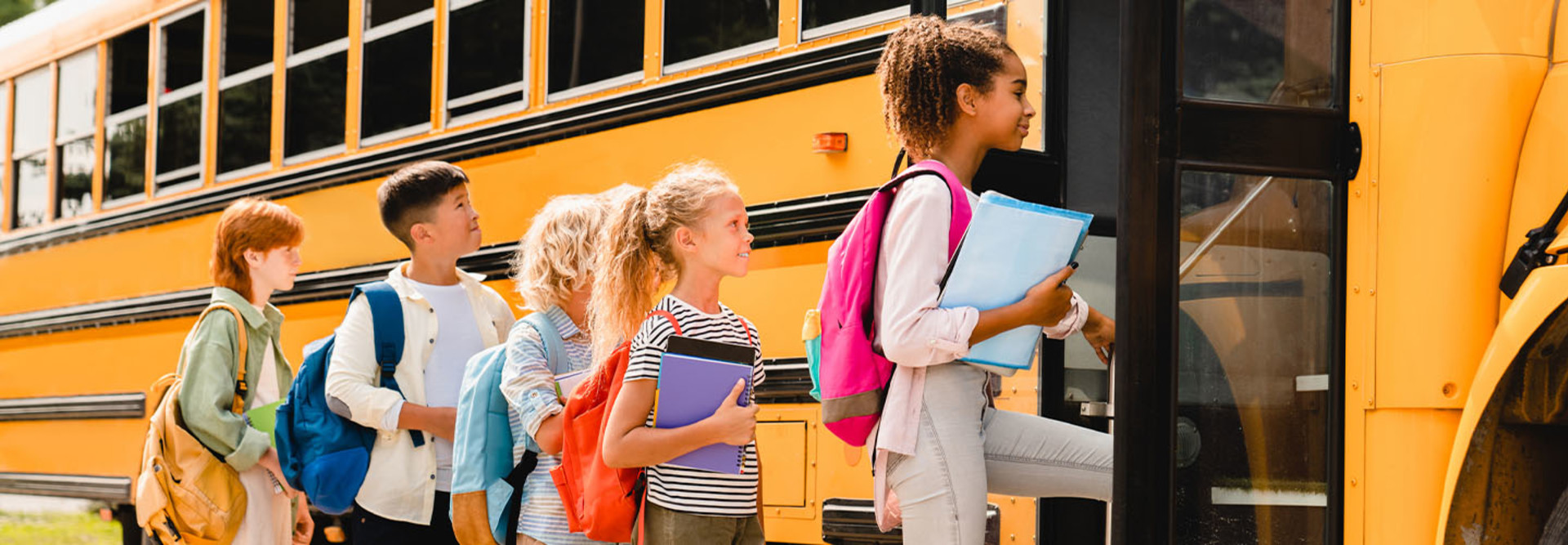 Kids boarding a school bus