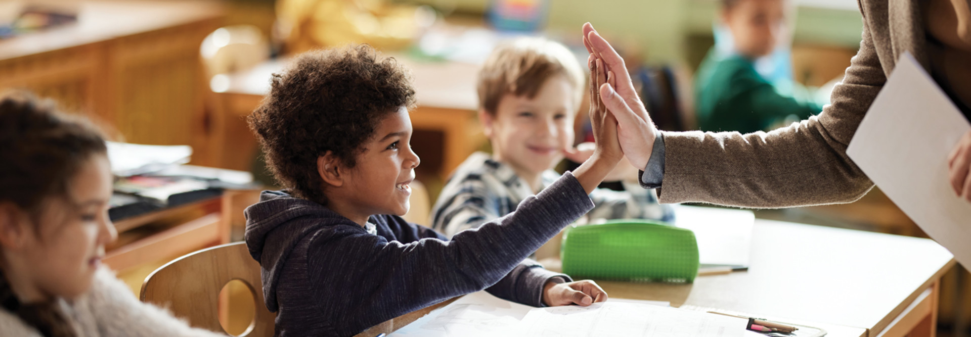 School kids excited in class