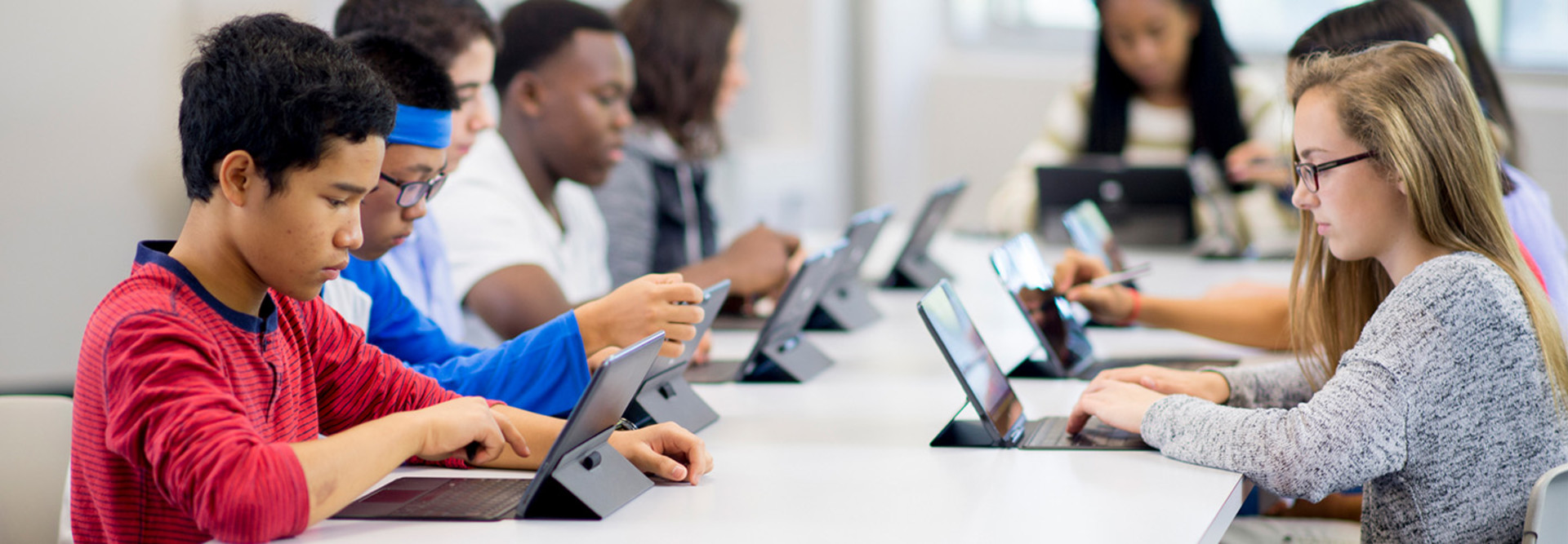 Students working on tablets in classroom