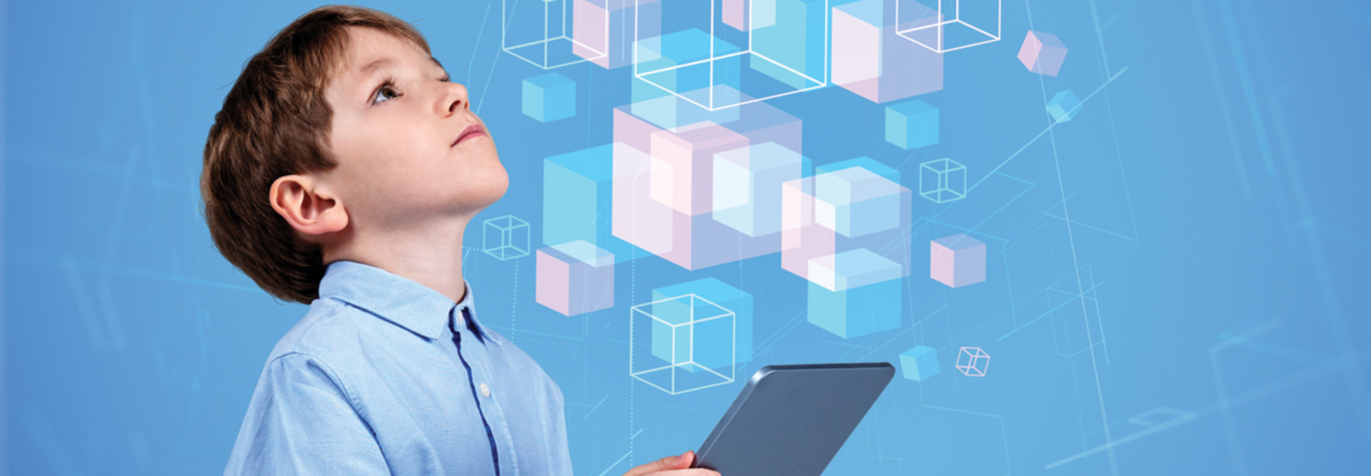 little boy holding tablet and looking at illustrated floating cubes