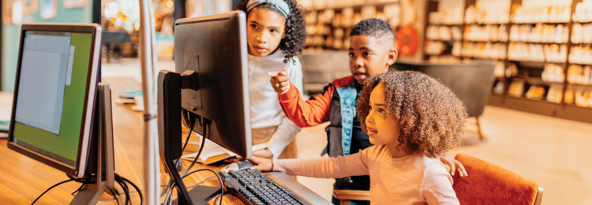 Students using a computer in class