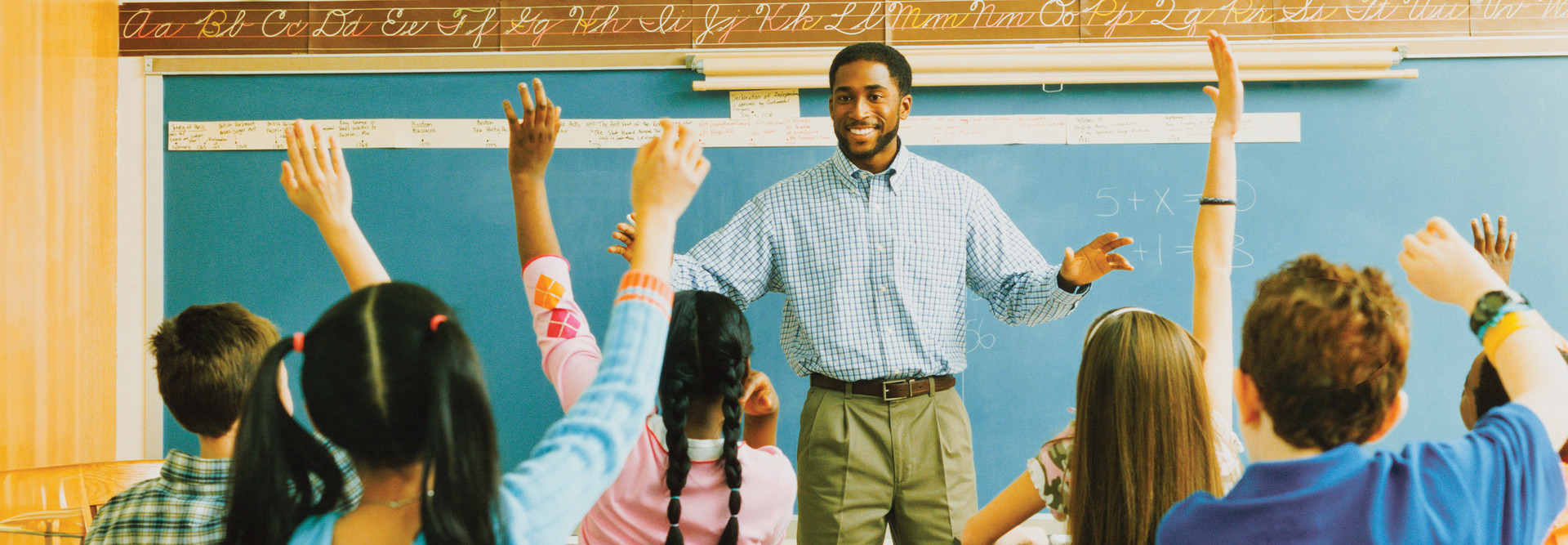 Teacher at the chalkboard calling on students