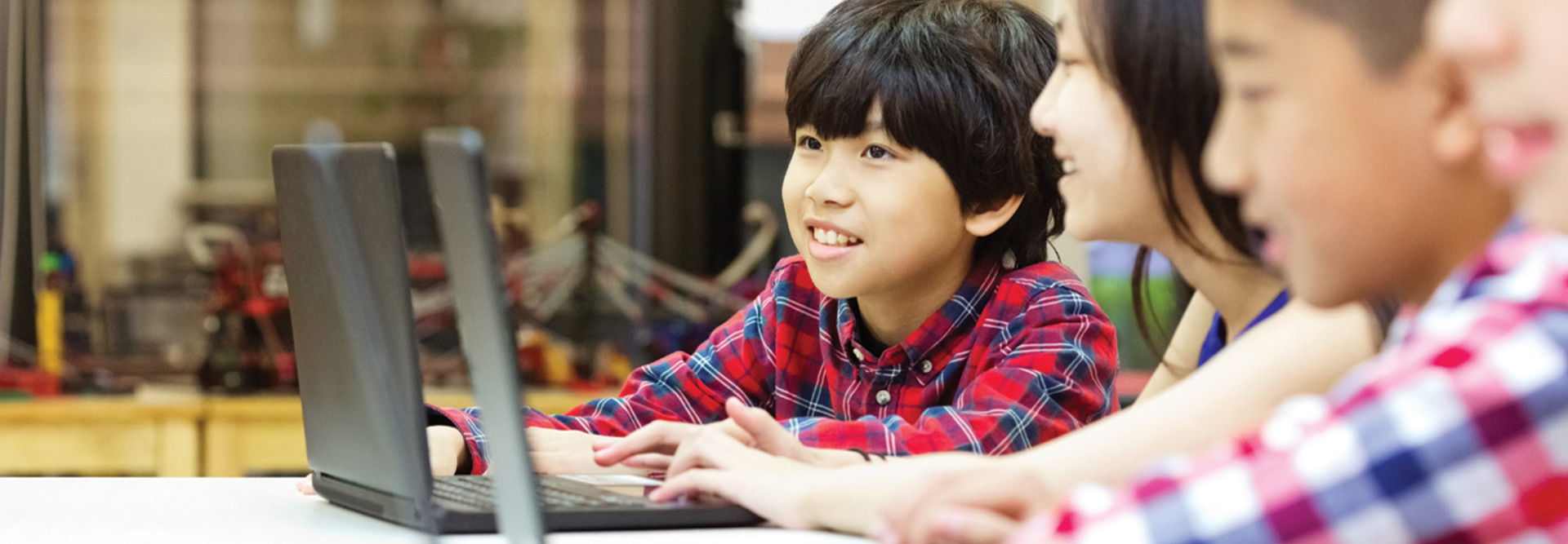 Students using laptops in school