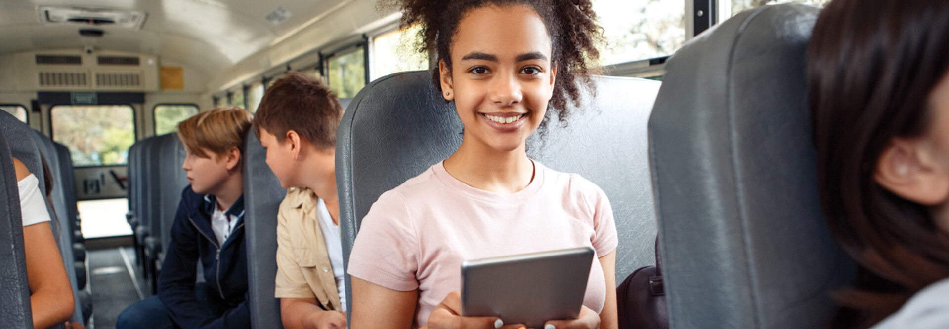 Student using tech on the bus
