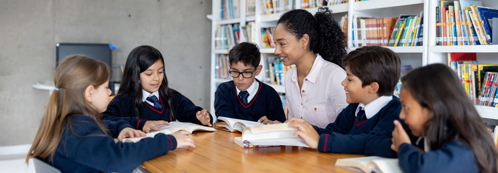Teacher working with students at a private school