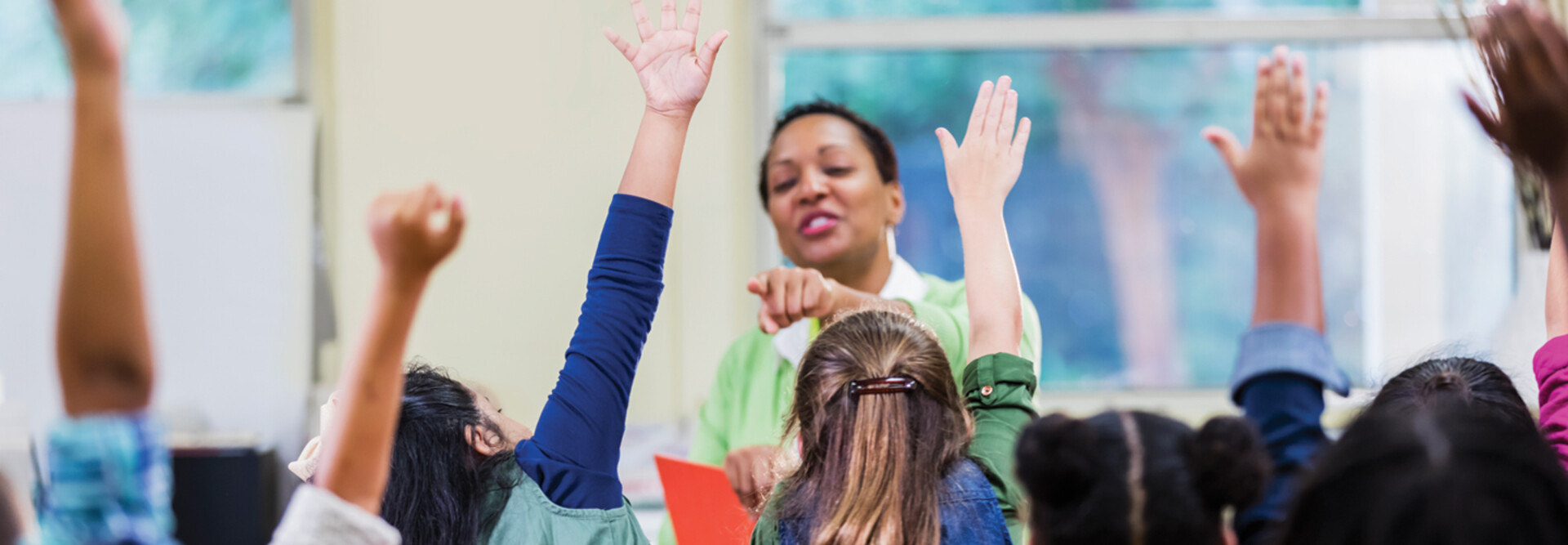 Teacher and students in elementary school classroom
