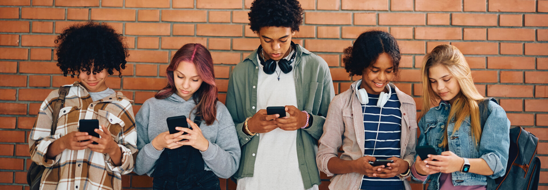 Students looking at phones in school