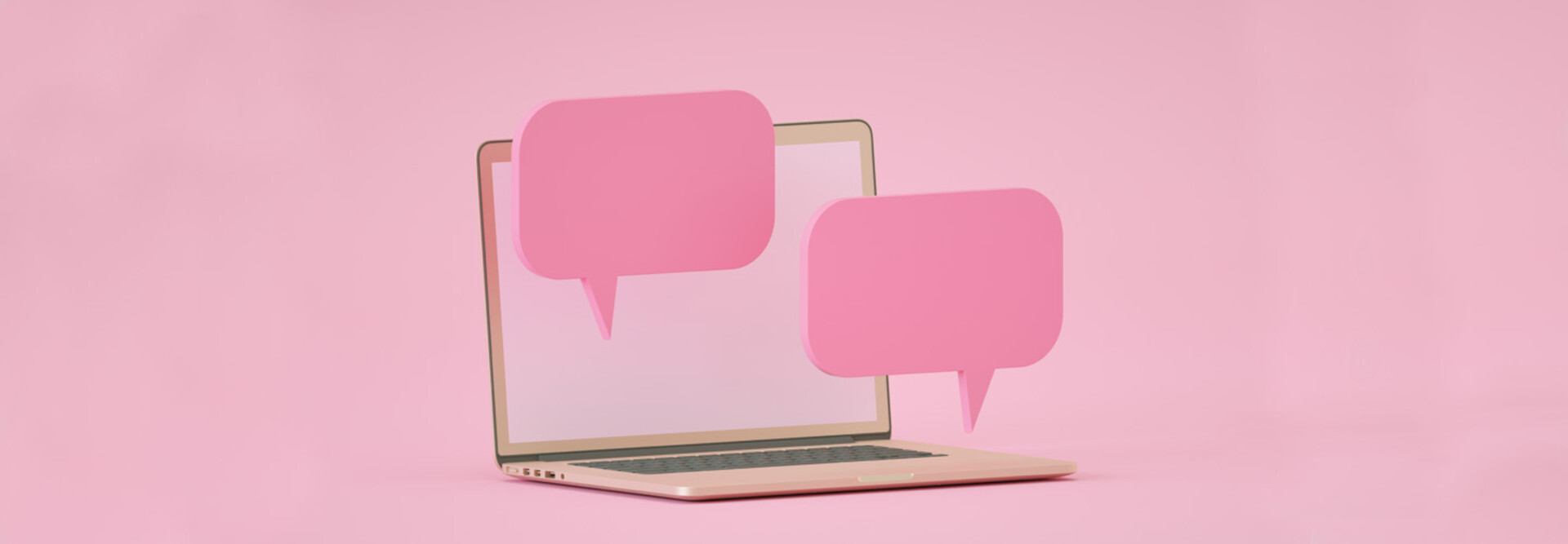 computer against pink backdrop with floating pink speech bubbles to indicate chatroom
