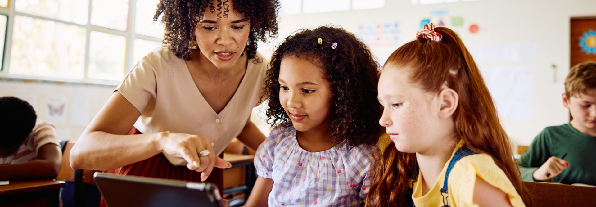 School teacher helping students