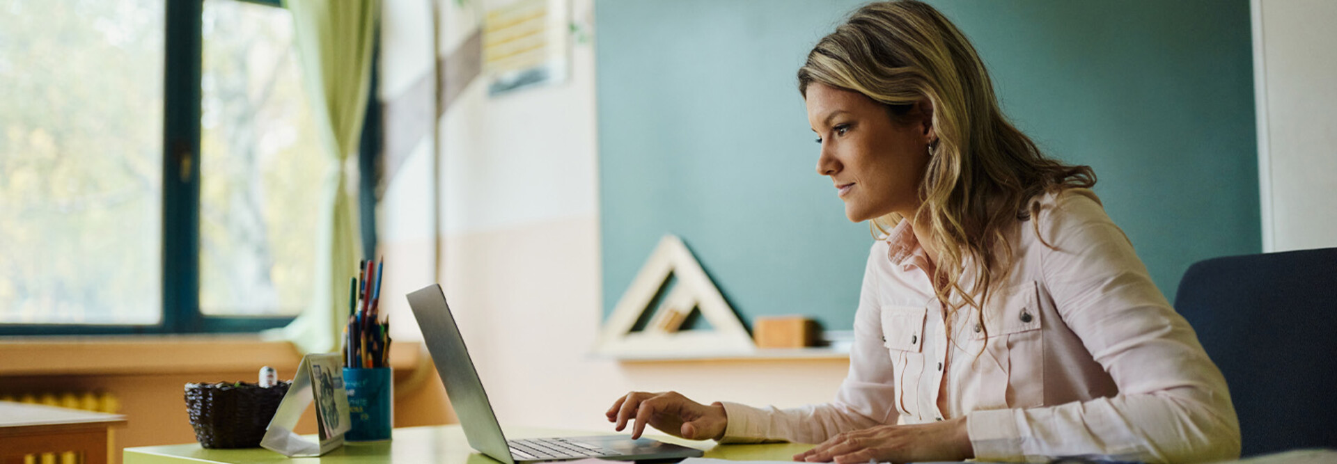 Teacher using laptop
