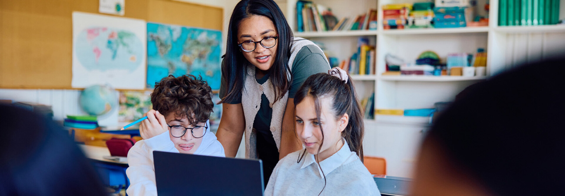 Students using computer in classroom