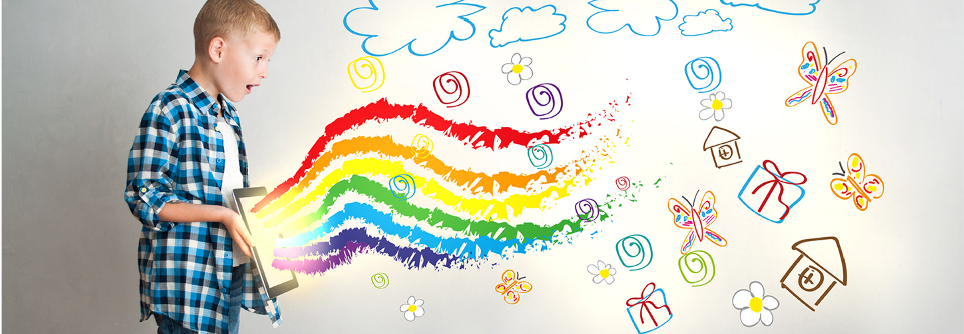 Kid uses ipad with rainbows coming out