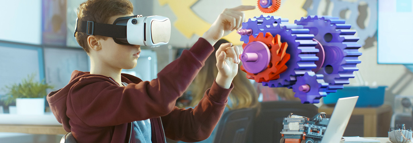 Student uses augmented reality platforms and vr education apps to learn coding.