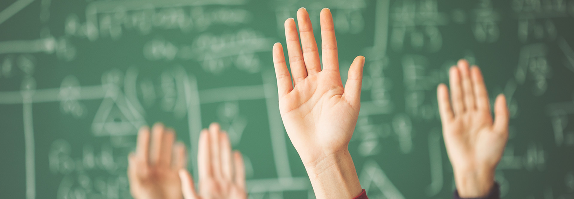 Hands in a classroom