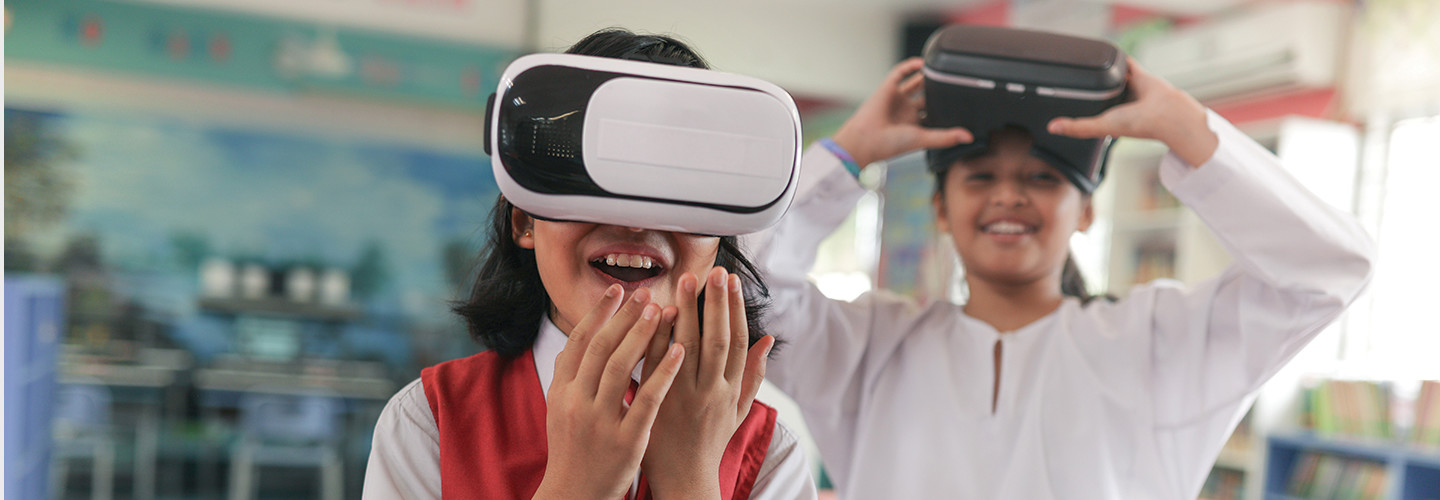 two kids using a vr headset