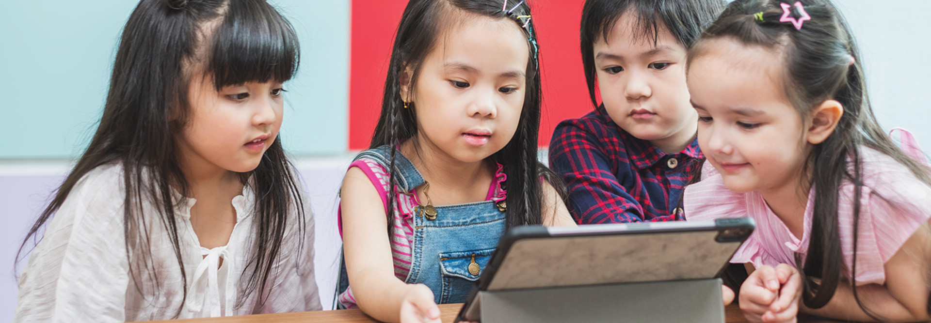 Group of kids remote learning on tablet 