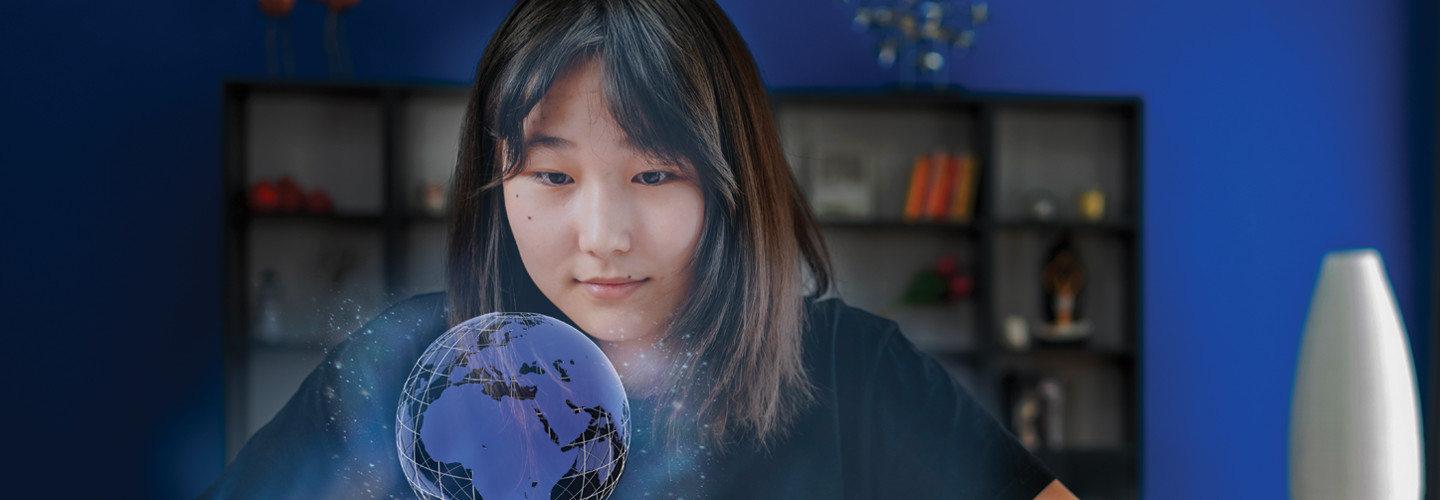 World language student uses technology to view a holographic projection of globe