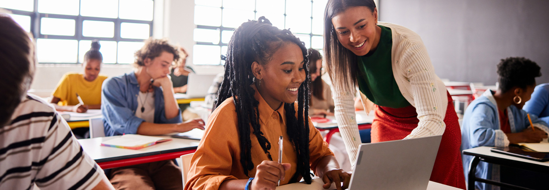 Students using laptops in class
