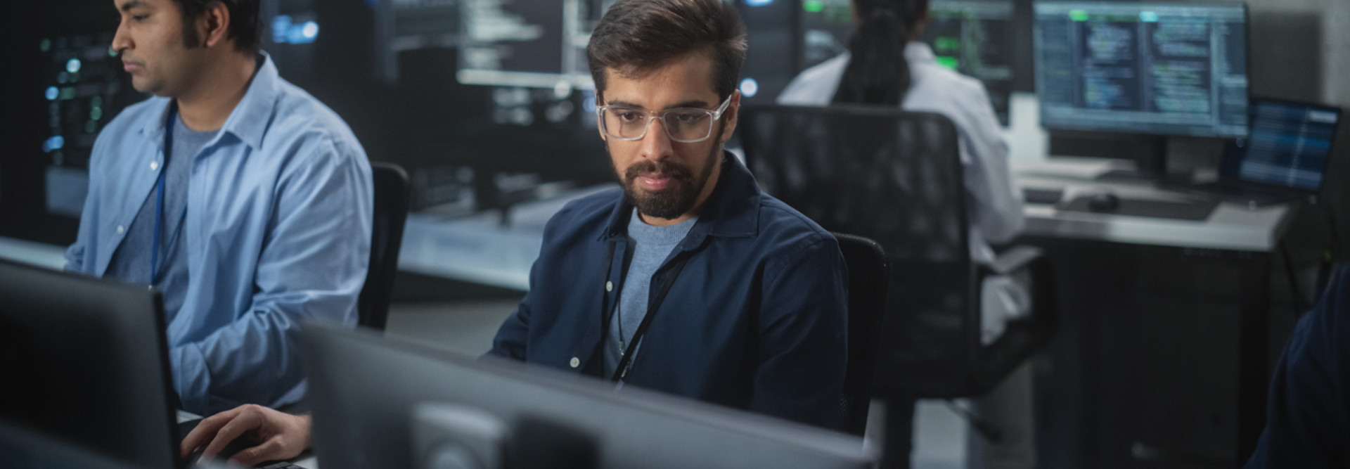 Team of programmers working in office