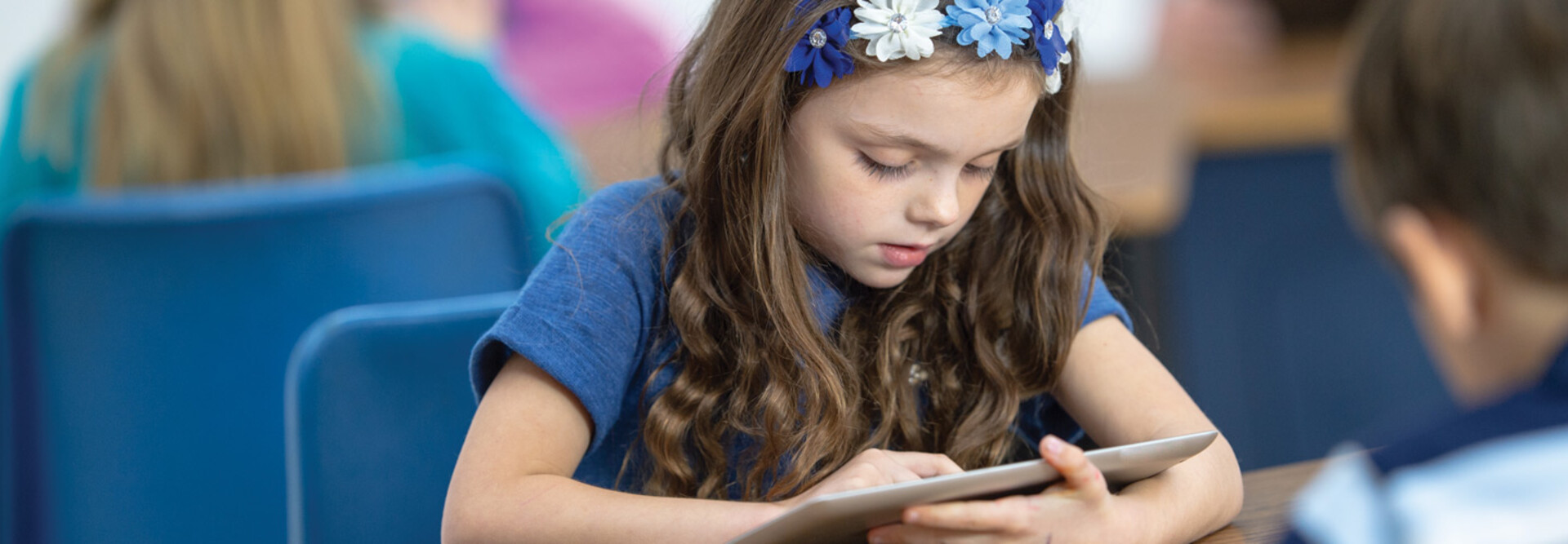 Student using tablet in class