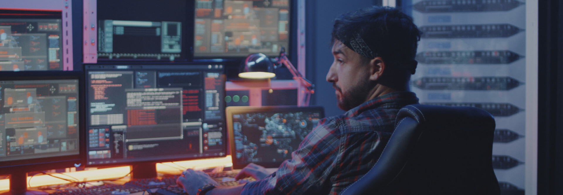 Security alerts appearing on multiple screens while man watches