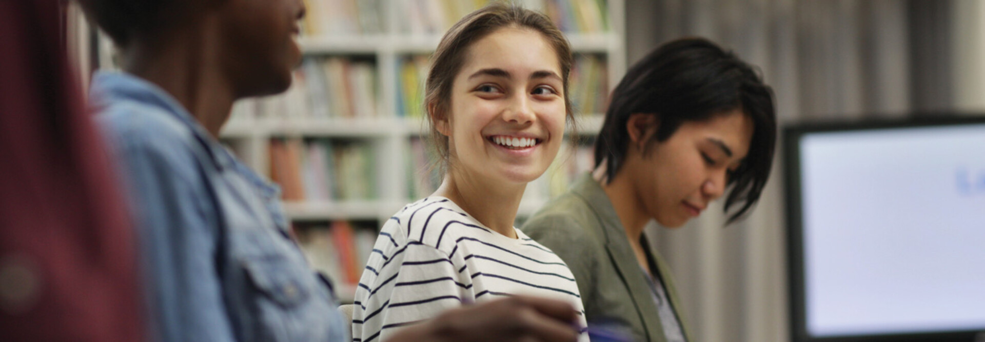 Students talking in the library