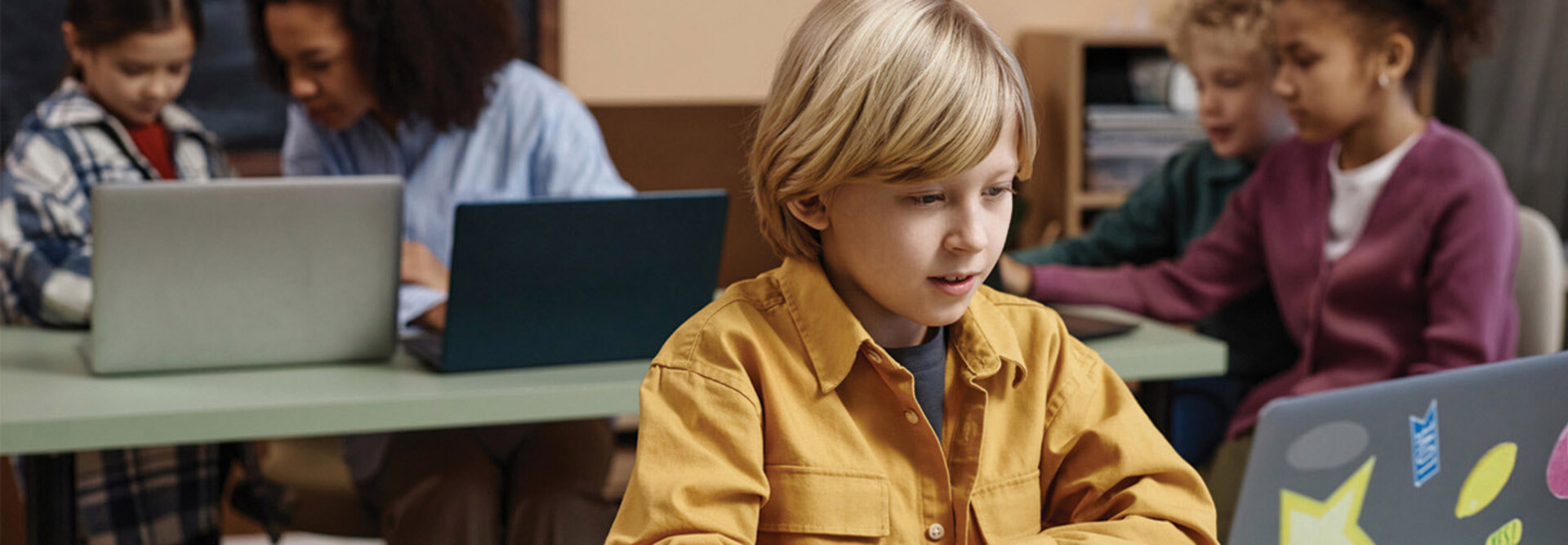 Boy on Laptop in classroom