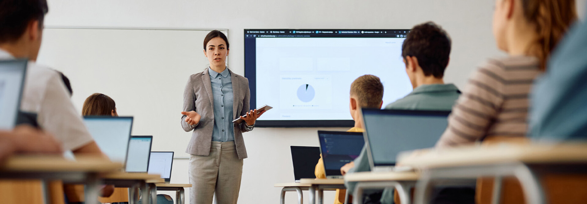 Teacher instructing class with technology