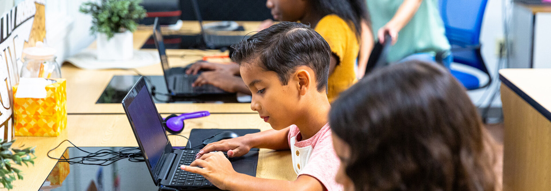 Students using tech in classroom